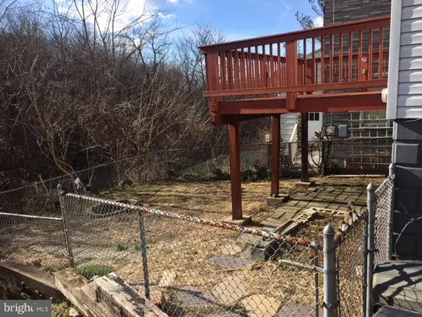 a view of a house with a wooden deck
