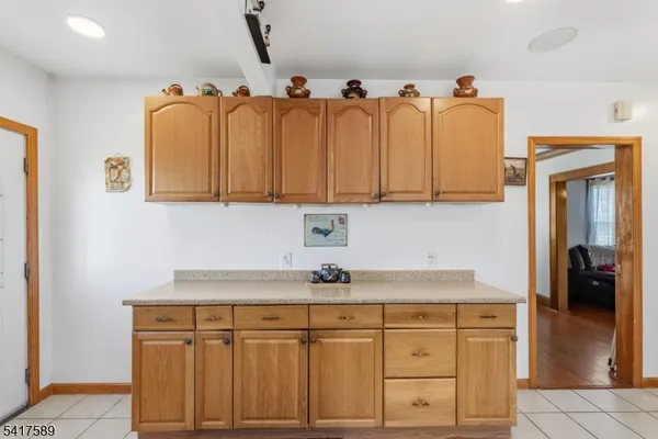 a kitchen with stainless steel appliances granite countertop a sink and cabinets