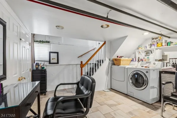 a utility room with lots of chairs and furniture
