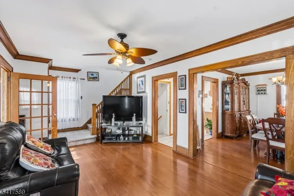 a view of a livingroom with furniture and a flat screen tv