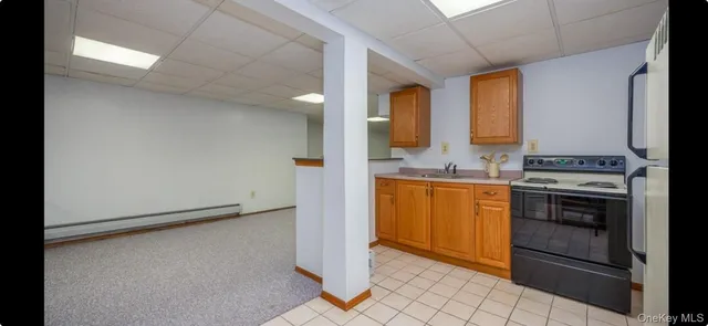 a kitchen with a refrigerator stove and sink