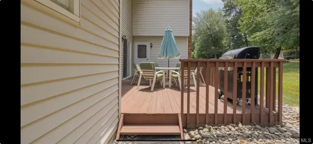 a view of balcony with furniture