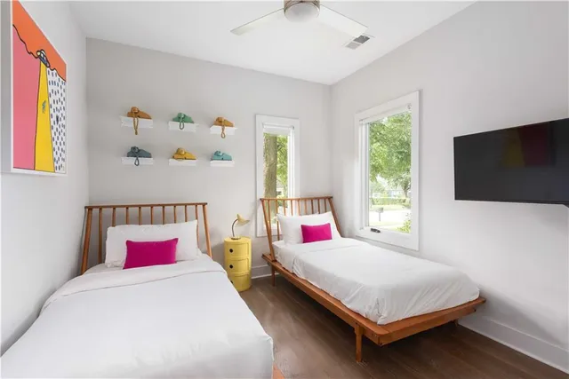 a bedroom with a bed and a flat screen tv