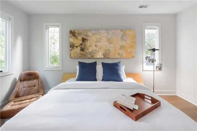 a bedroom with a bed and window