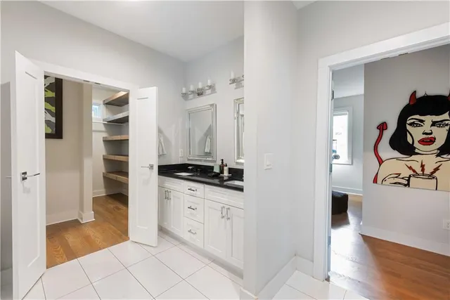 a kitchen with granite countertop a sink and a stove