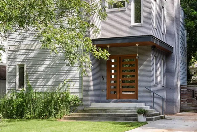 a front view of a house with garden