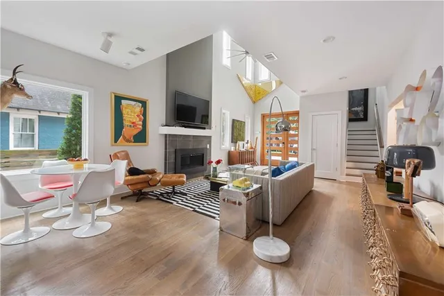 a living room with furniture fireplace and flat screen tv