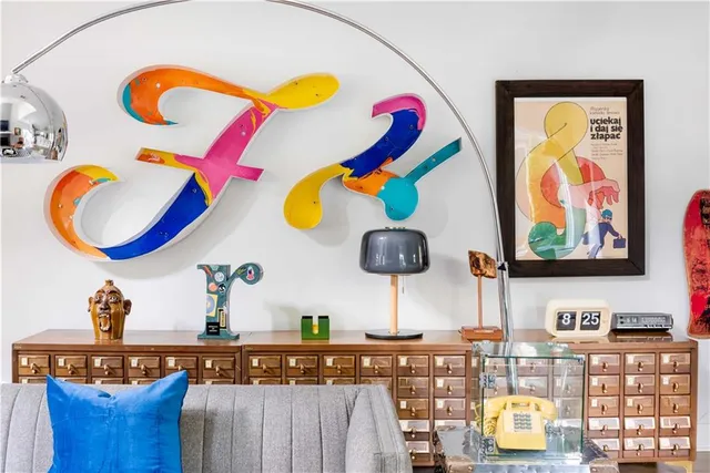 a room with painting and a table