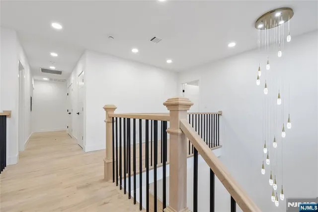 a view of a hallway with stairs