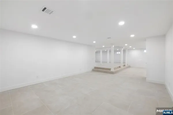 a view of a park with large trees