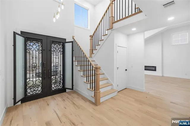 a view of entryway with wooden floor