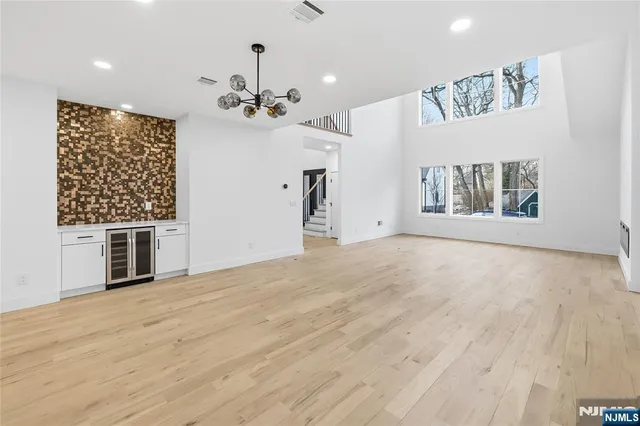 a view of a livingroom with a kitchen and a stove