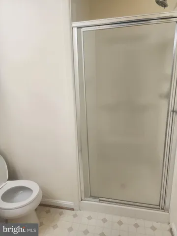 a kitchen with cabinets and white appliances