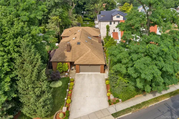 an aerial view of a house with a yard and garden view