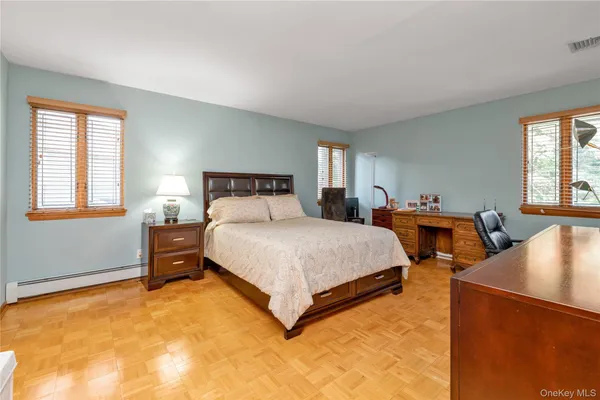 a bedroom with bed and window