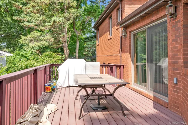 a view of a deck with furniture and wooden deck