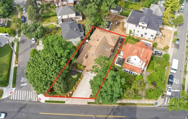 an aerial view of a house with a yard and garden