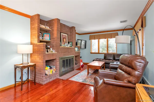 a work room with furniture and a fireplace