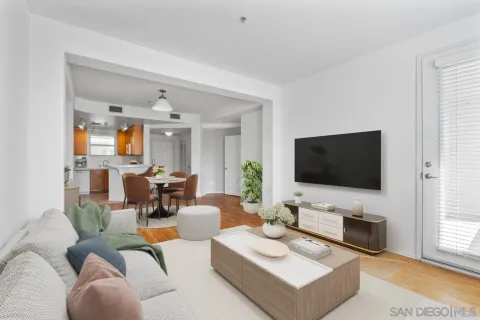 a bedroom with a balcony a bed and a flat screen tv