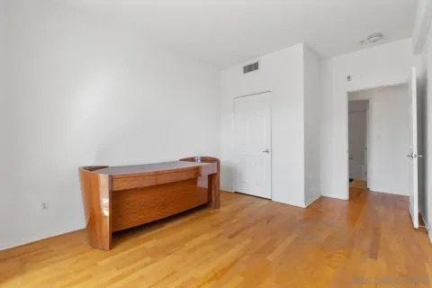 a living room with a bed furniture and a window
