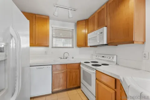 a view of a livingroom with wooden floor and cabinet