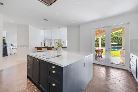 a bedroom with a large bed and a large window