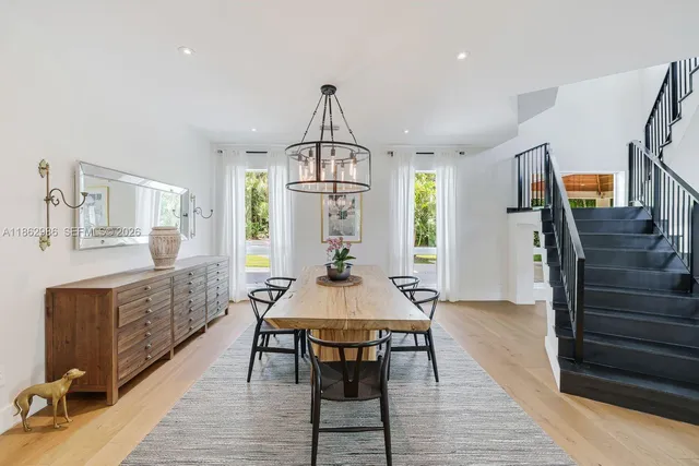 a view of a patio with couches potted plants and a big yard