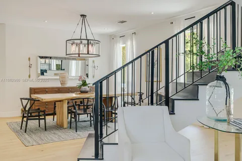 a bathroom with a sink a toilet a mirror and shower