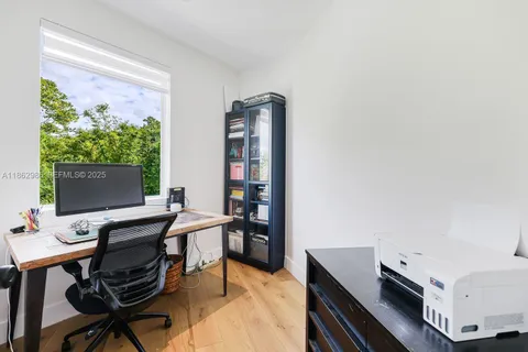 a kitchen with stainless steel appliances a refrigerator and a stove top oven