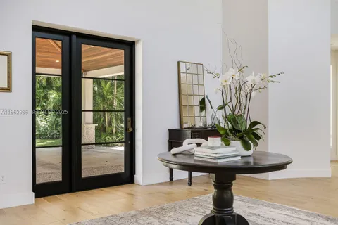 a living room with furniture or couch and a wooden floor