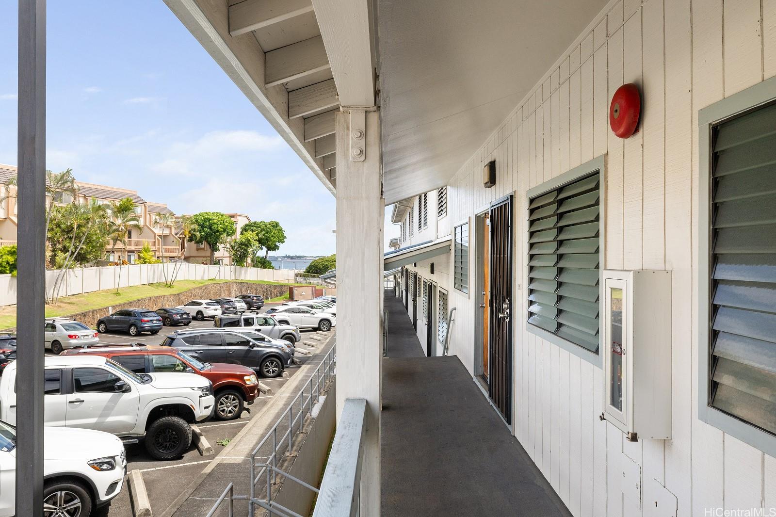 98-660 Moanalua Loop, Unit 276 Aiea, HI 96701 - Photo 16 of 25 a view of a kitchen filled with furniture and window