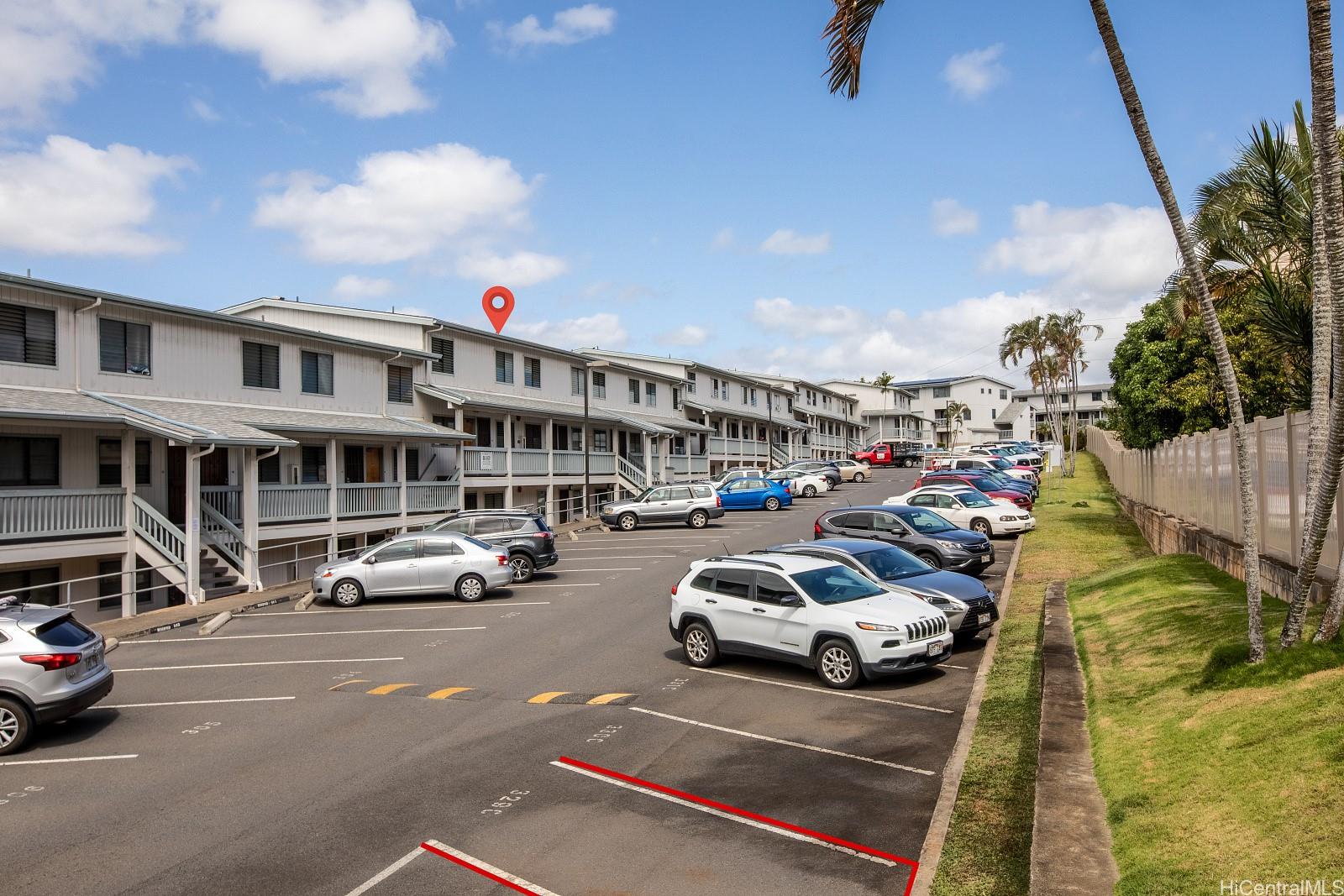 98-660 Moanalua Loop, Unit 276 Aiea, HI 96701 - Photo 21 of 25 a view of a cars park in front of a building