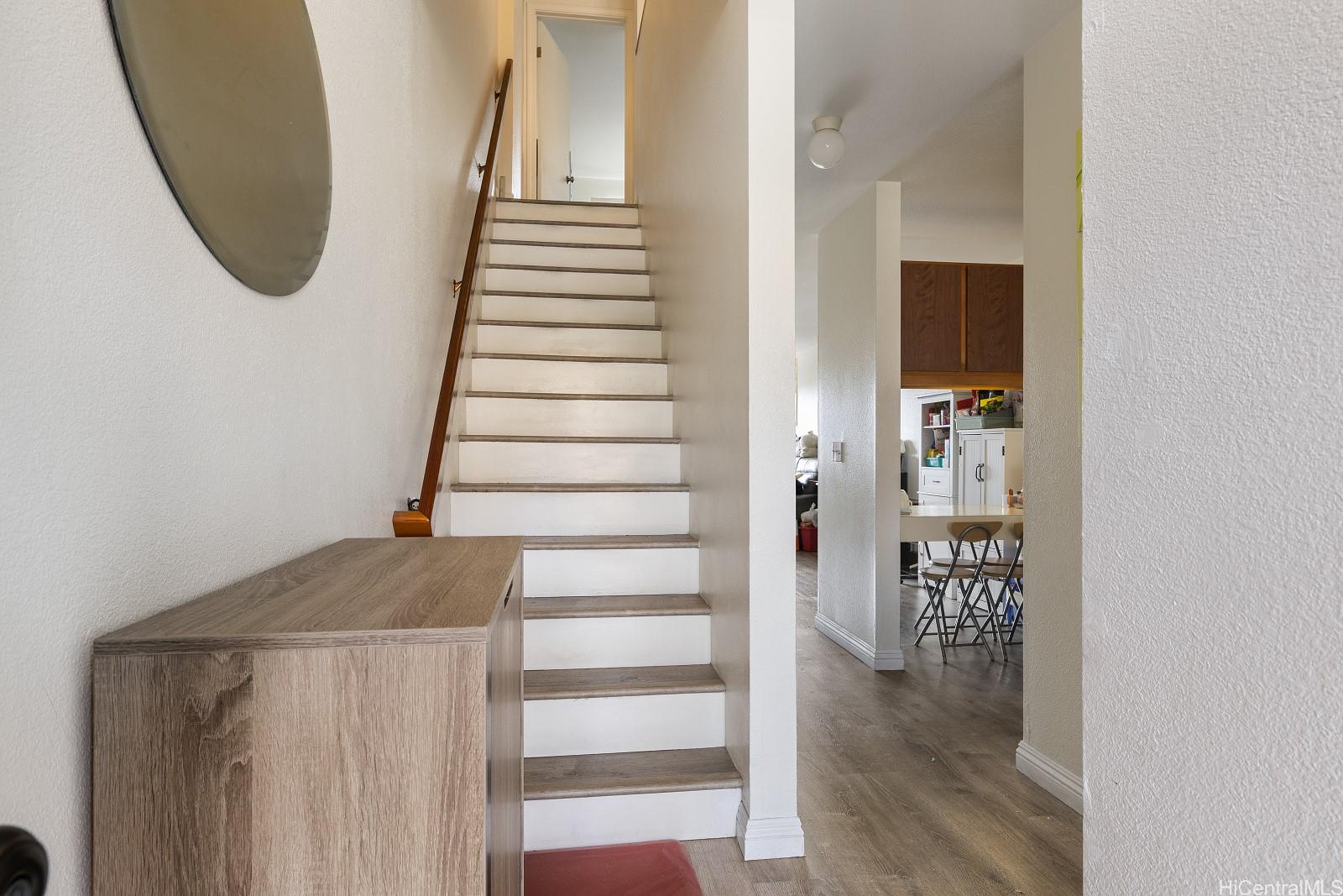 98-660 Moanalua Loop, Unit 276 Aiea, HI 96701 - Photo 7 of 25 a view of entryway and hall with wooden floor