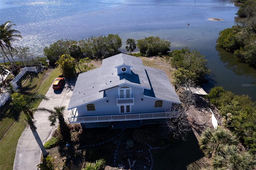 145 Burns Road Terra Ceia, FL 34250 - Photo 28 of 65 an aerial view of a house with a yard