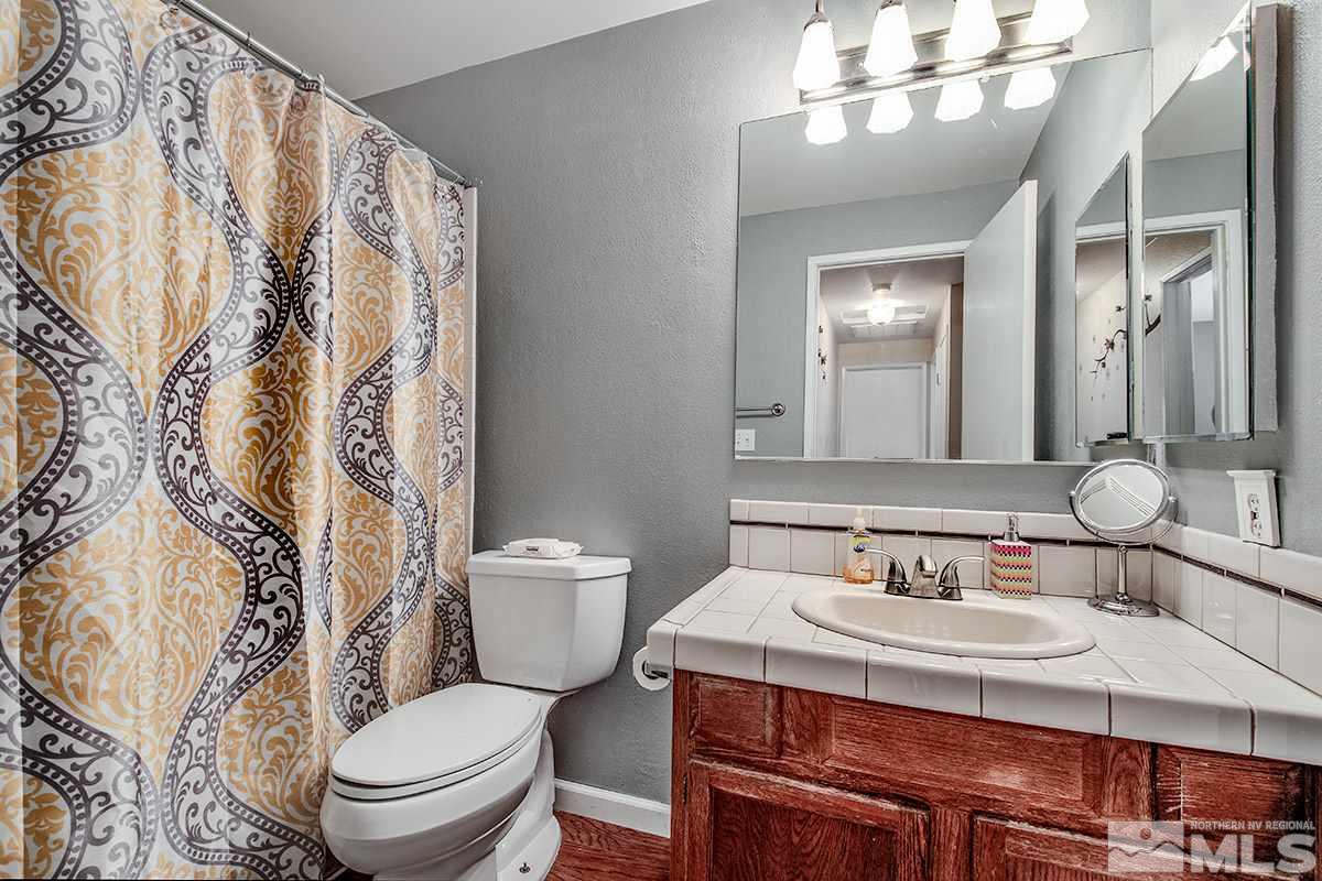 2642 Rayma Court Reno, NV 89503 - Photo 15 of 22 a bathroom with a sink toilet and shower