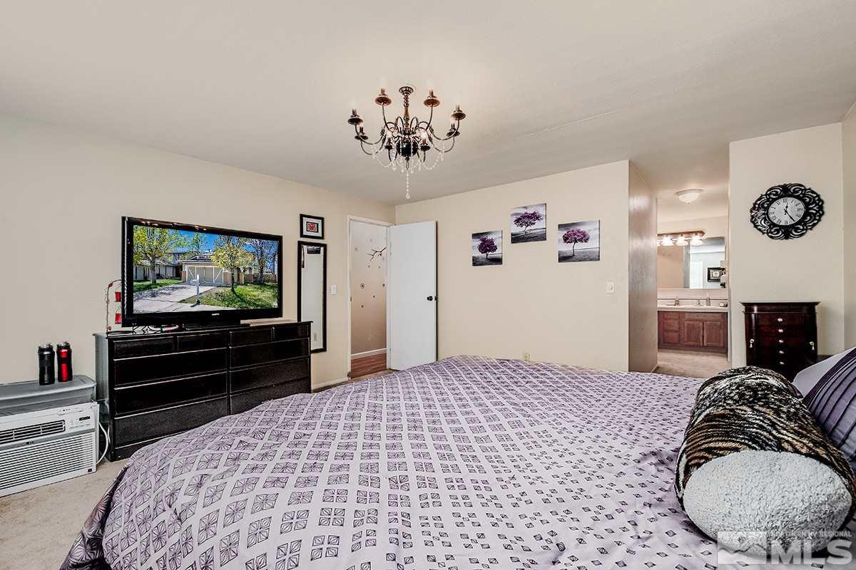 2642 Rayma Court Reno, NV 89503 - Photo 17 of 22 a bedroom with a bed and a television
