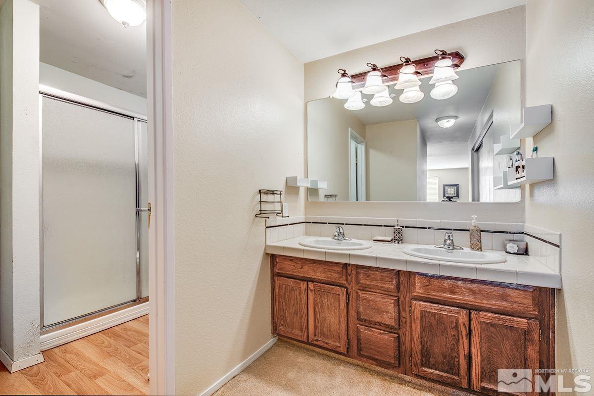 2642 Rayma Court Reno, NV 89503 - Photo 18 of 22 a bathroom with a sink vanity and a mirror