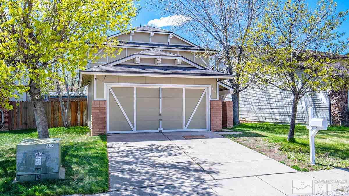 2642 Rayma Court Reno, NV 89503 - Photo 2 of 22 a front view of a house with a garden