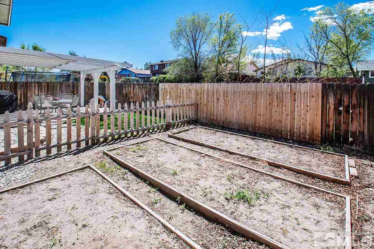 2642 Rayma Court Reno, NV 89503 - Photo 22 of 22 a view of a backyard with a fence
