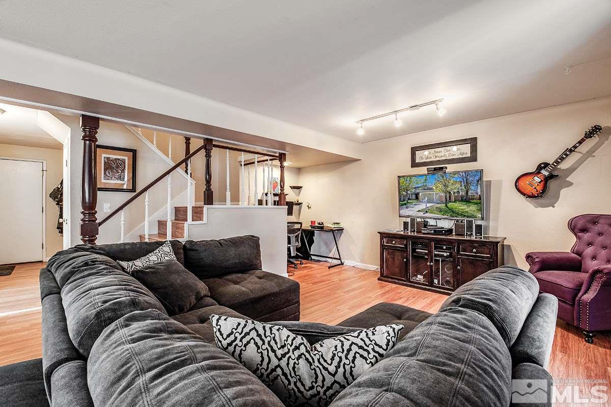 2642 Rayma Court Reno, NV 89503 - Photo 10 of 22 a living room with furniture ceiling fan and a rug
