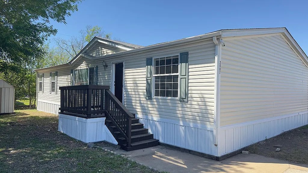 2607 George Street Round Rock, TX 78681 - Photo 11 of 14 a view of a house with wooden fence