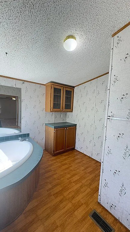 2607 George Street Round Rock, TX 78681 - Photo 13 of 14 a bedroom with a bed and a flat screen tv