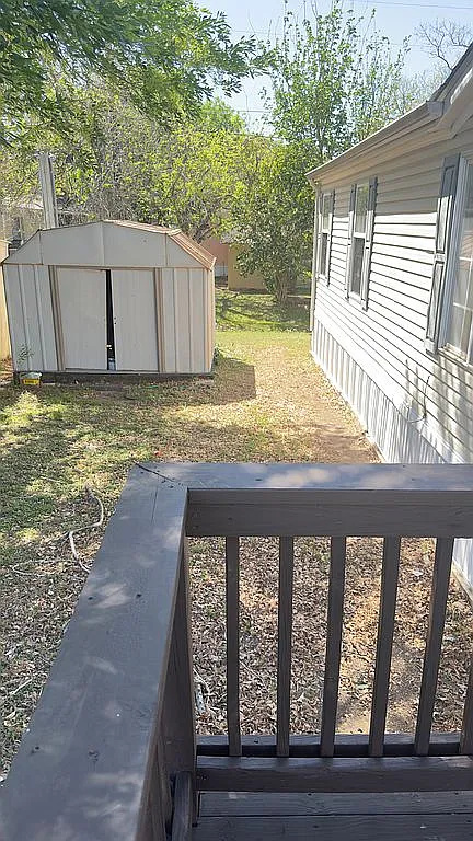 2607 George Street Round Rock, TX 78681 - Photo 14 of 14 a view of a backyard with wooden floor and fence