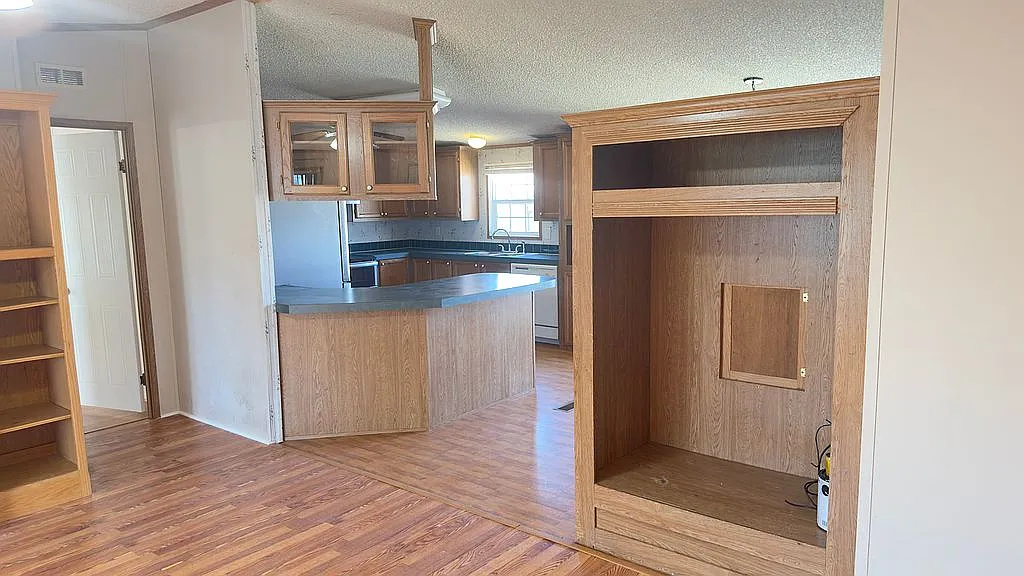 2607 George Street Round Rock, TX 78681 - Photo 5 of 14 a kitchen with stainless steel appliances granite countertop a refrigerator and a sink