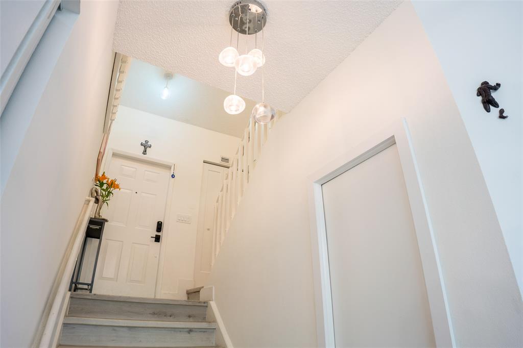 361 Southwest 95 Terrace, Unit 361 Pembroke Pines, FL 33025 - Photo 6 of 14 a view of a hallway with wooden floor and entryway