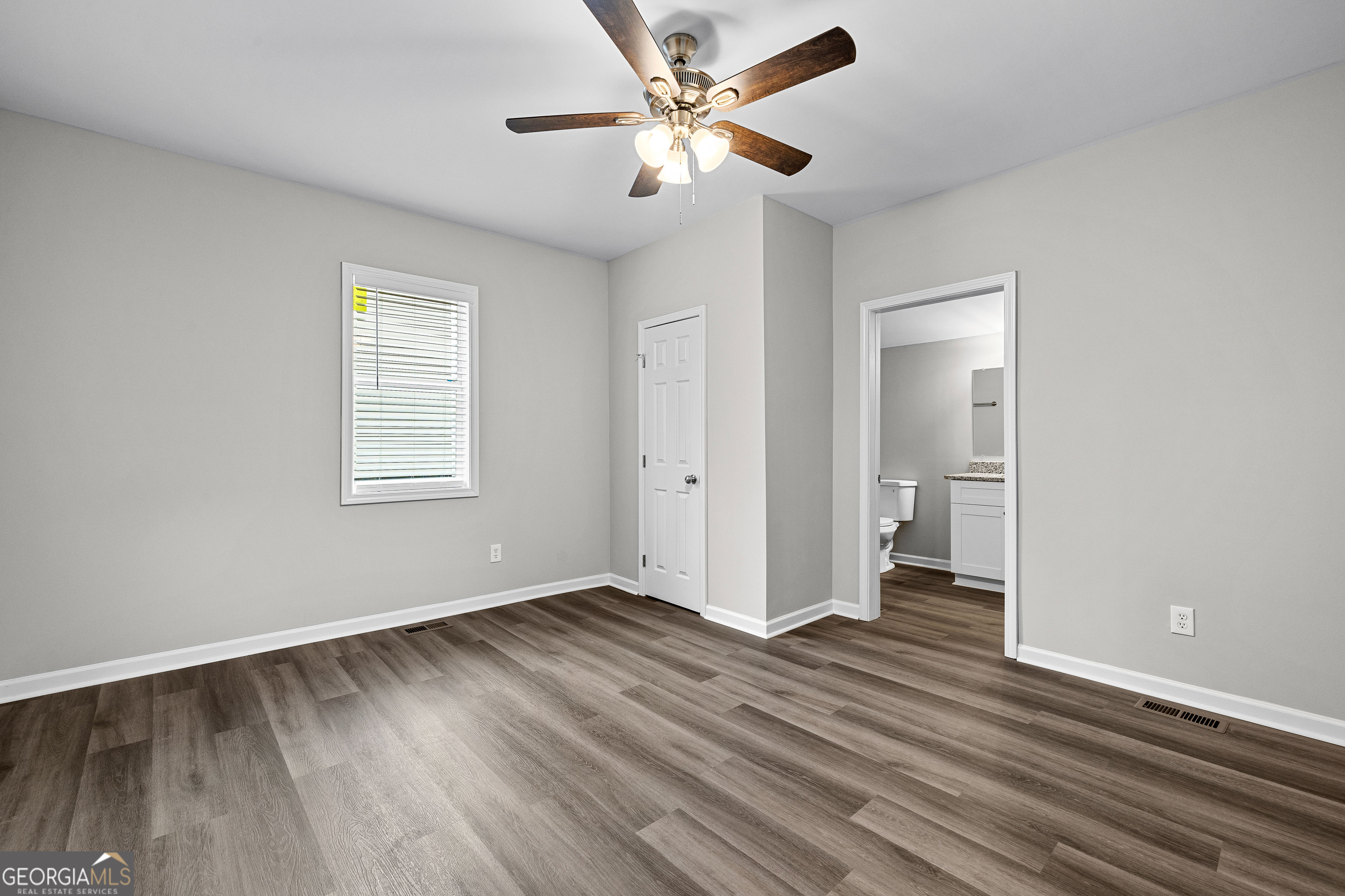 21 Shepard Street Grantville, GA 30220 - Photo 16 of 29 wooden floor in an empty room with a window
