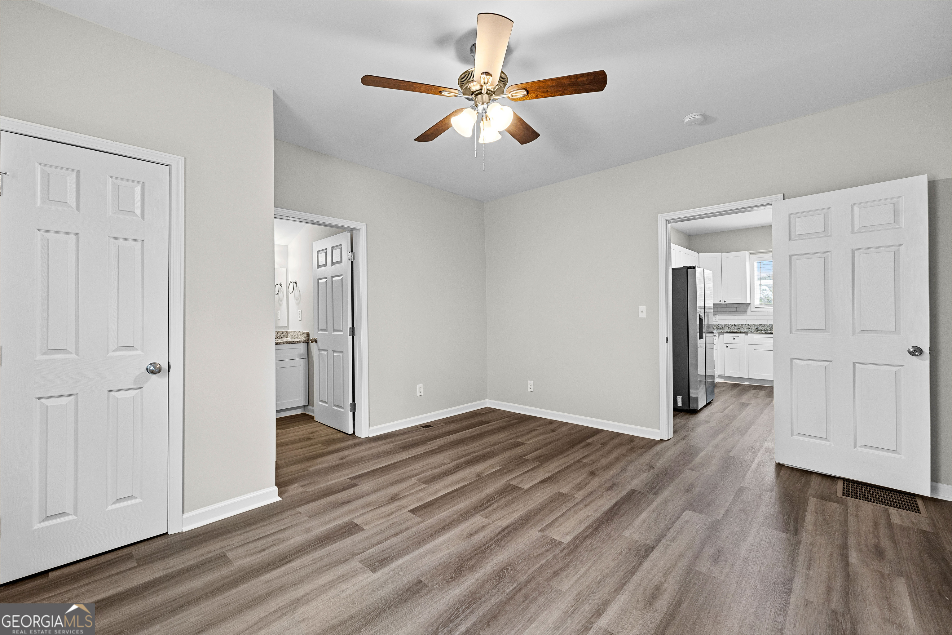 21 Shepard Street Grantville, GA 30220 - Photo 17 of 29 wooden floor in an empty room with a window
