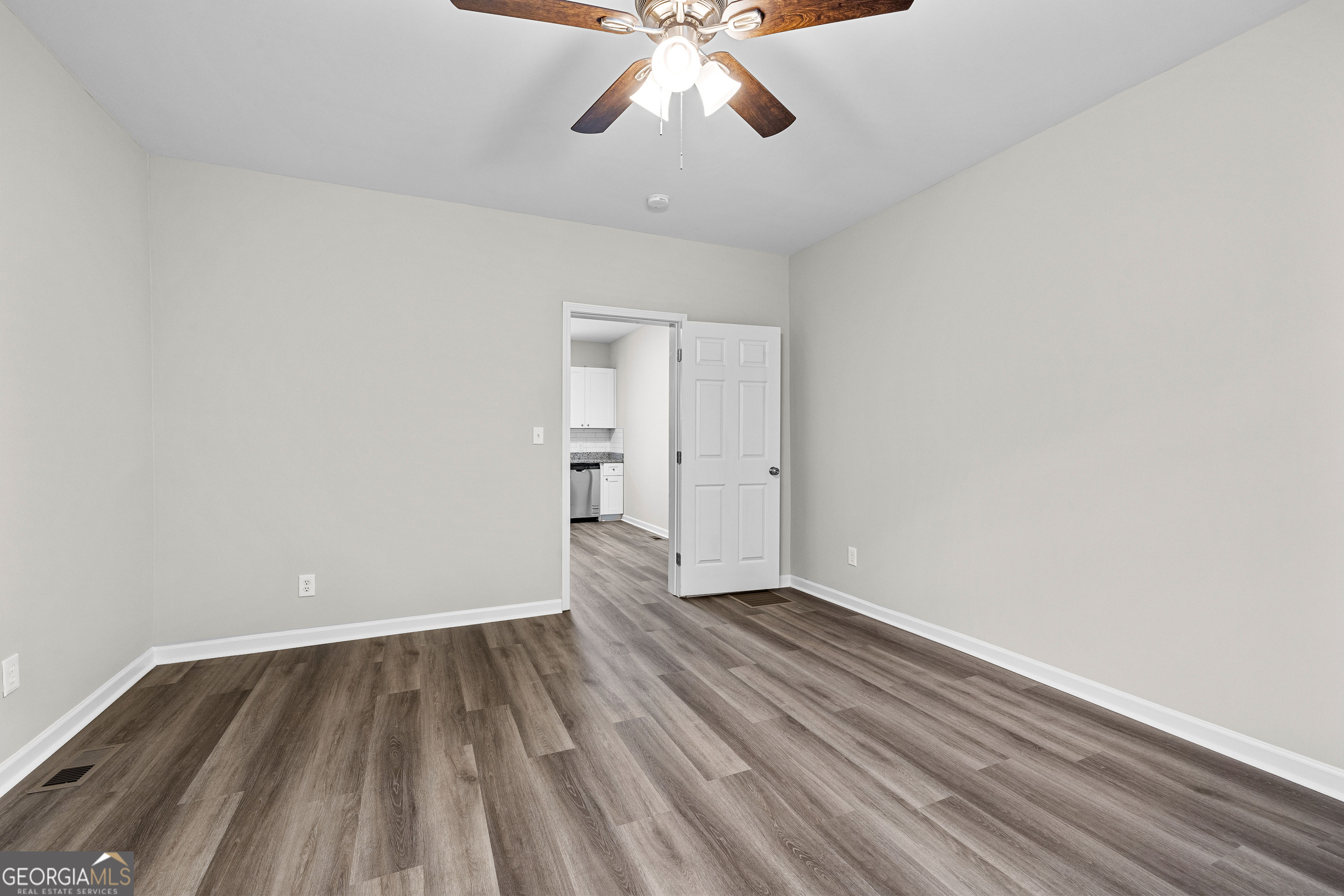21 Shepard Street Grantville, GA 30220 - Photo 20 of 29 wooden floor in an empty room with a window