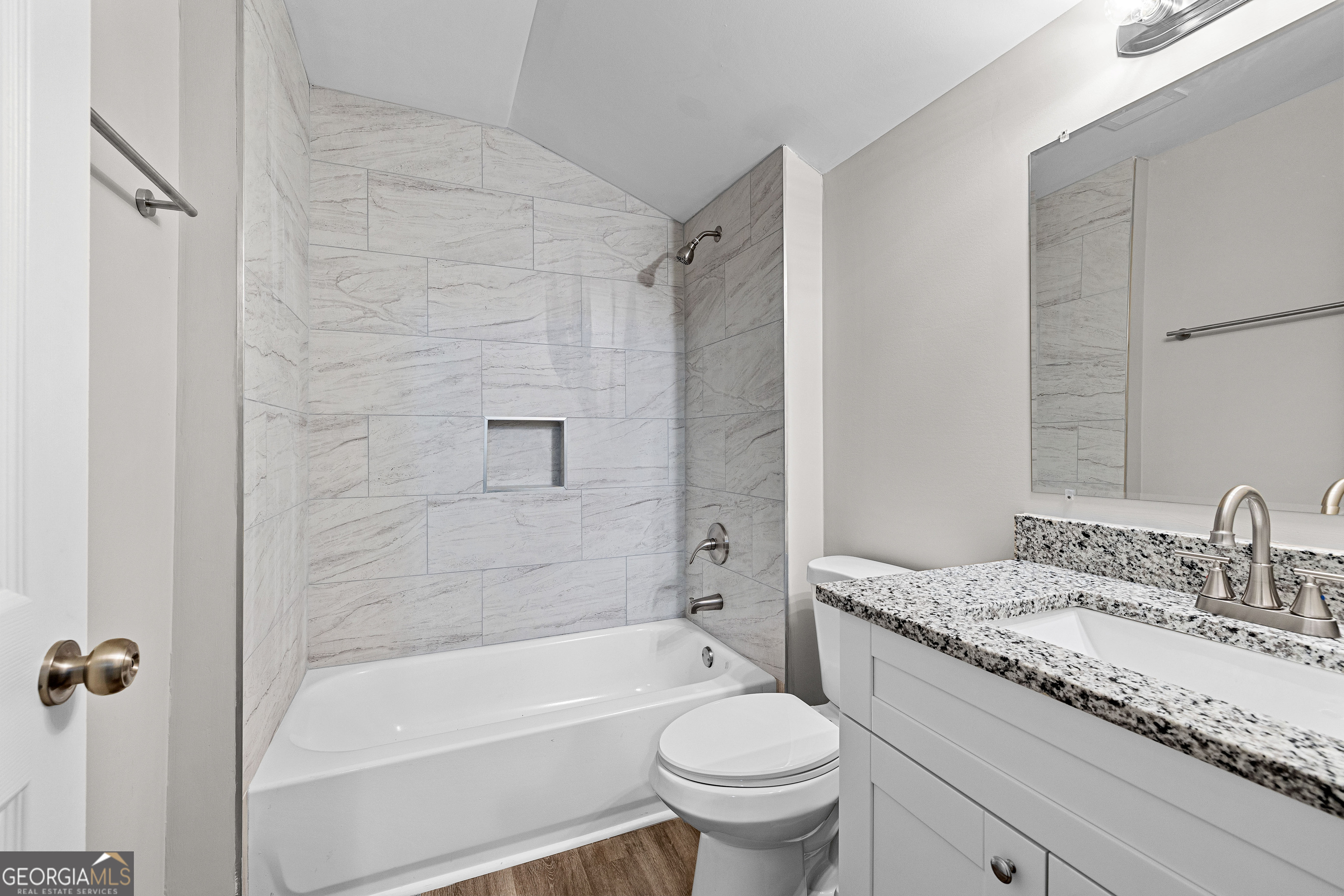 21 Shepard Street Grantville, GA 30220 - Photo 23 of 29 a bathroom with a granite countertop toilet a sink and a bathtub
