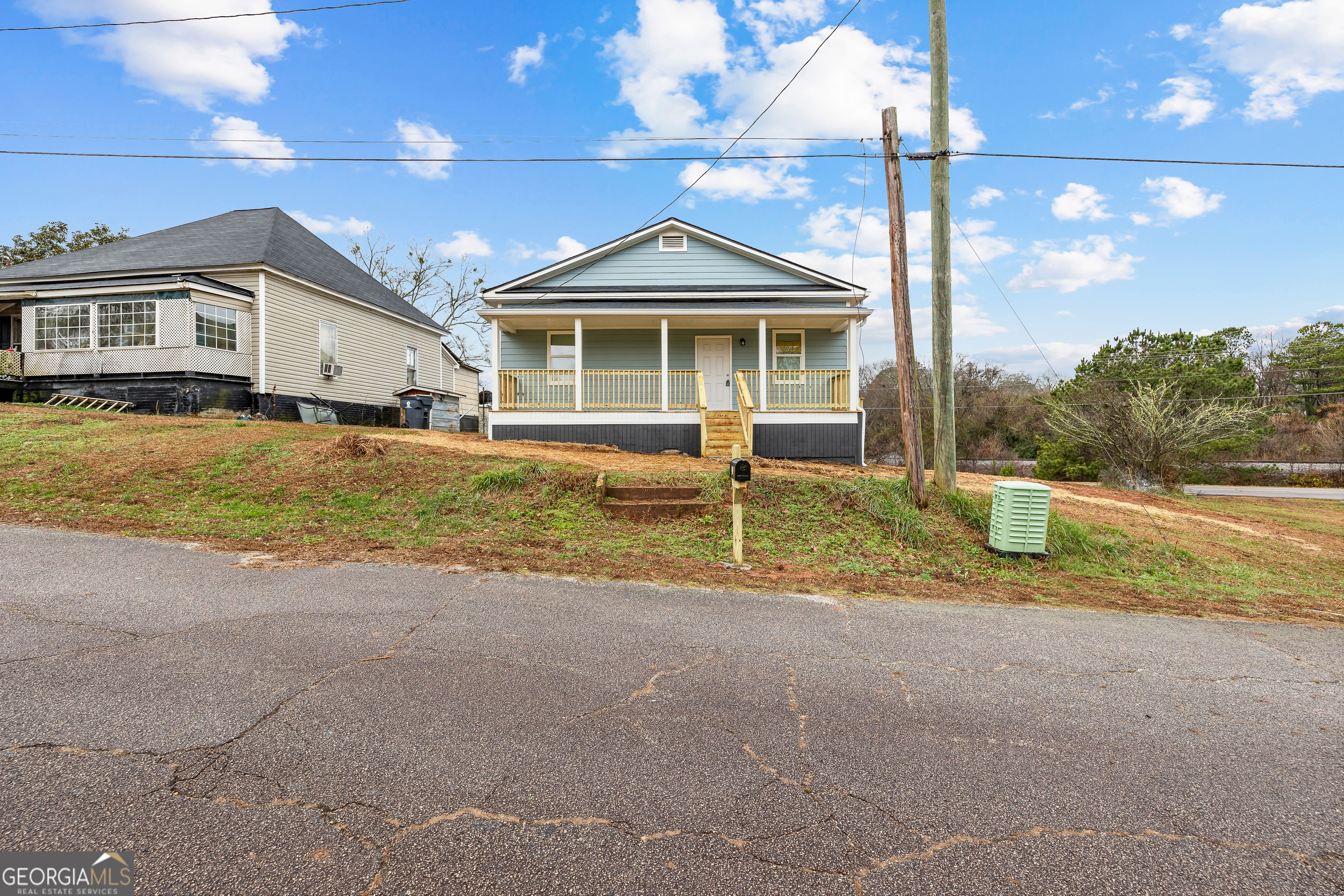 21 Shepard Street Grantville, GA 30220 - Photo 29 of 29 a front view of a house with a yard and garage